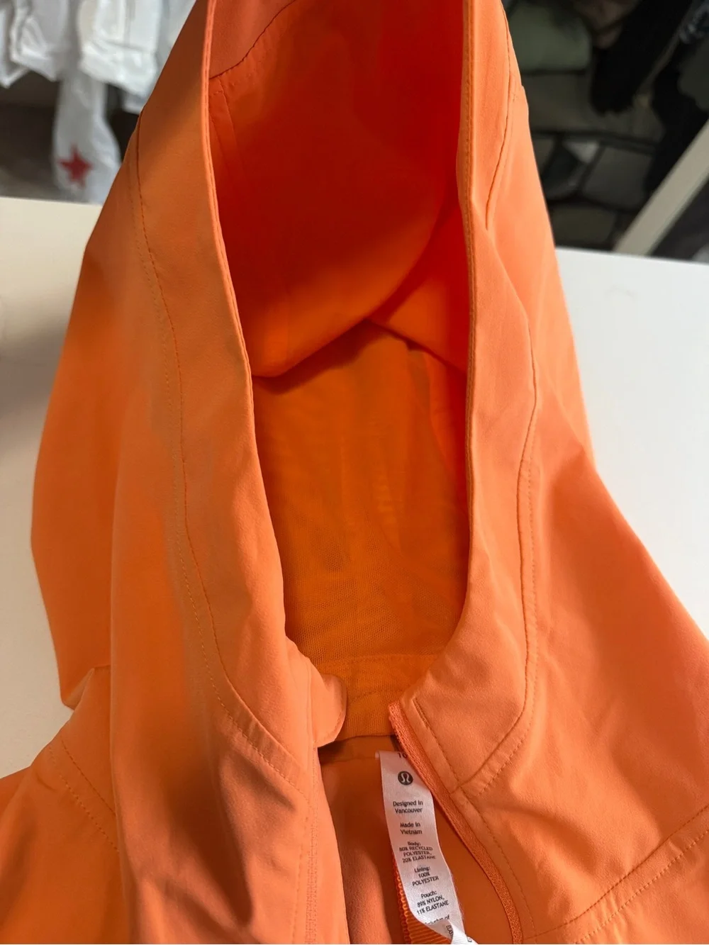 Lululemon hooded wind/rain jacket. Worn once, beautiful orange/peach color.